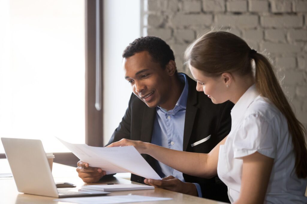 Business colleagues reviewing documents together.